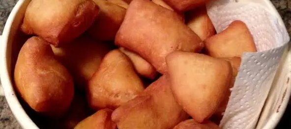 Bowl of freshly fried golden mandazi